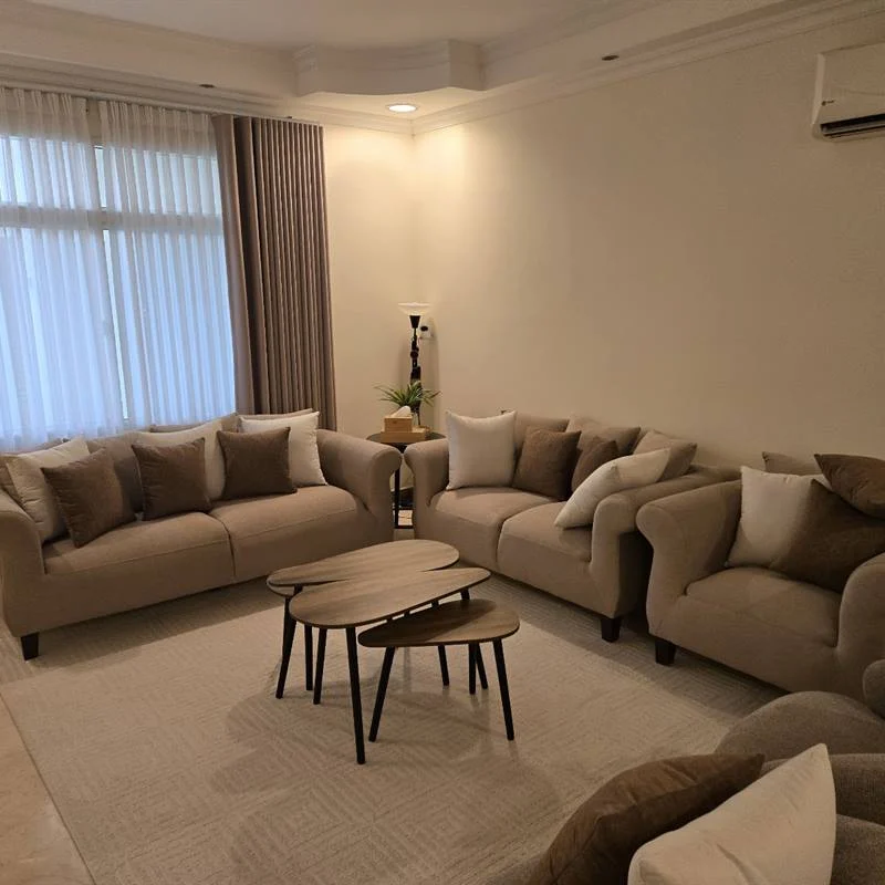 Villa living room with lined curtains, sheers and a sofa set made by Al Abdali in Doha